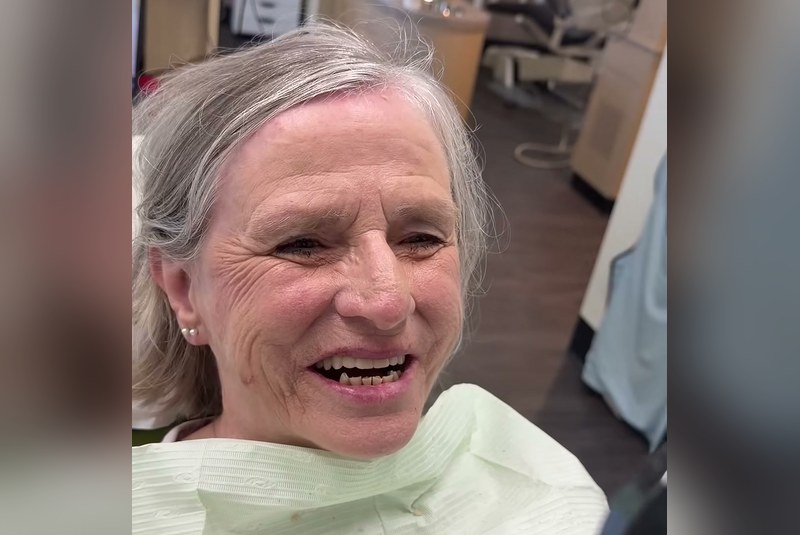 Avenue Dental Care patient smiling after full mouth extraction and dentures